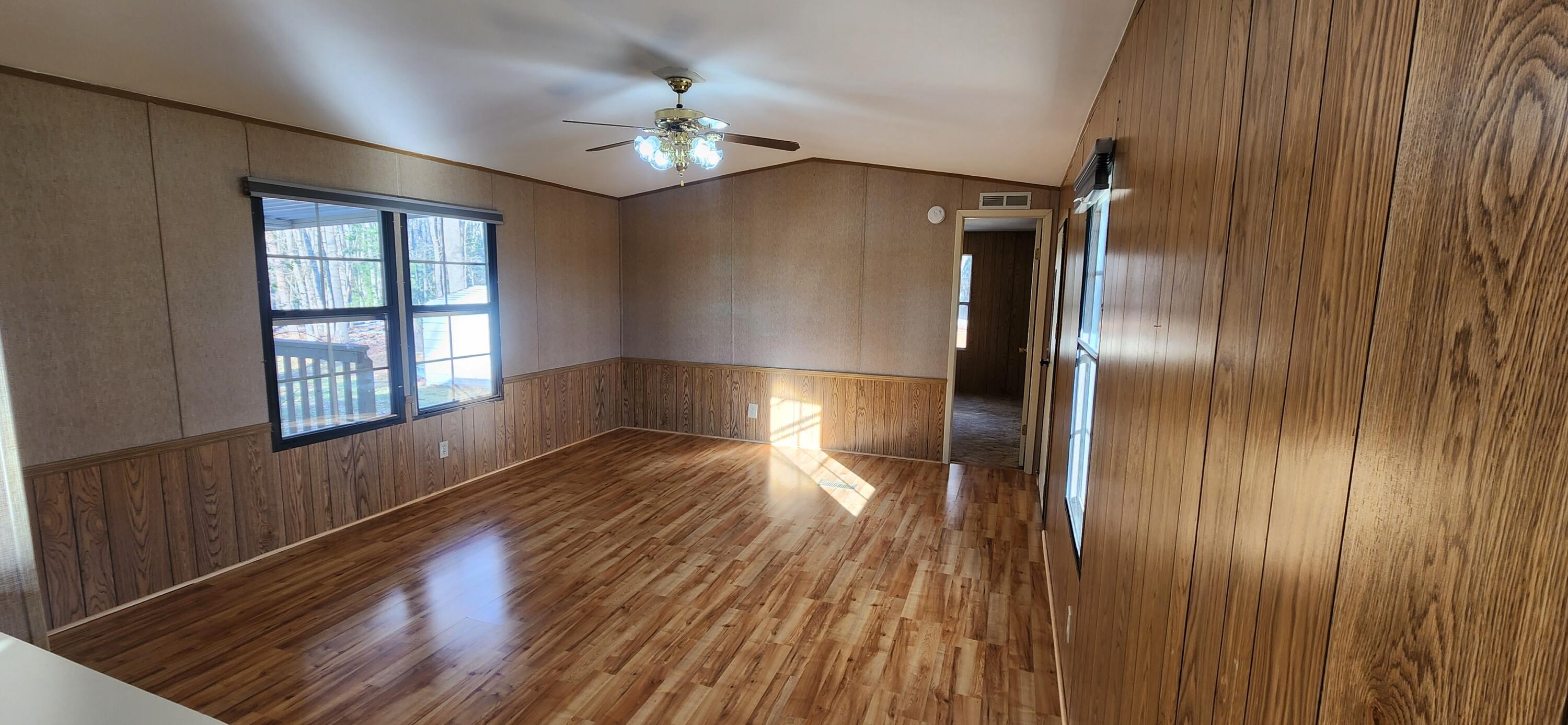 621 Kent Road Wirtz, VA 24184 - Photo 5 of 18 a view of empty room with wooden floor and fan