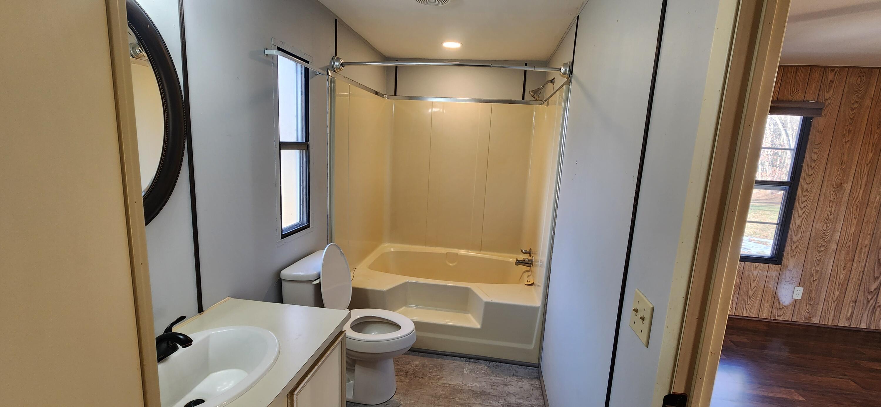 621 Kent Road Wirtz, VA 24184 - Photo 6 of 18 a bathroom with a shower and a toilet
