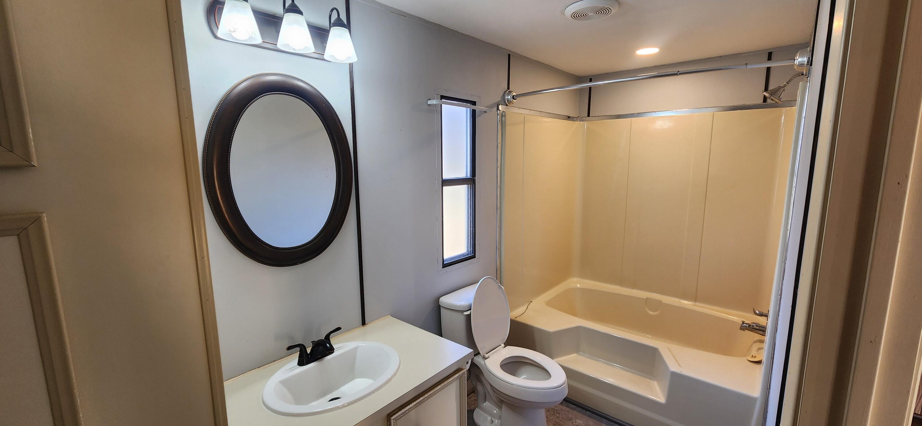 621 Kent Road Wirtz, VA 24184 - Photo 7 of 18 a bathroom with a toilet a sink and a shower
