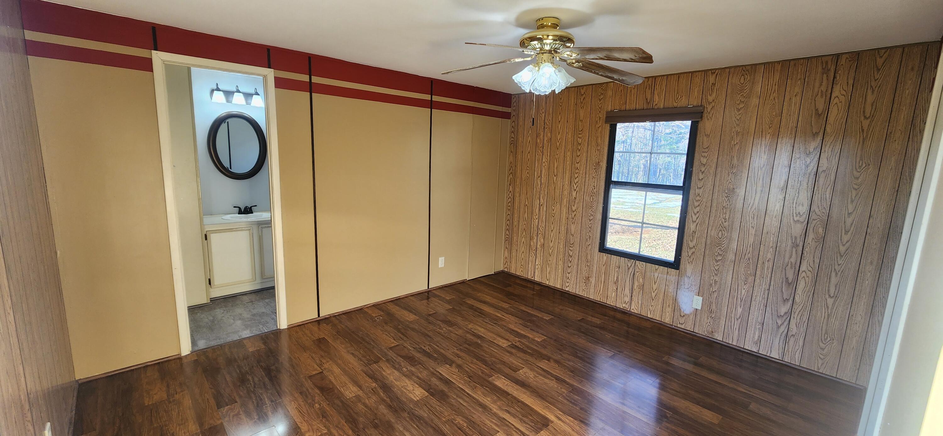 621 Kent Road Wirtz, VA 24184 - Photo 9 of 18 a view of empty room with wooden floor and fan