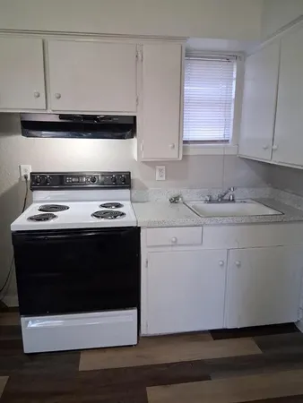 a utility room with sink washer and dryer