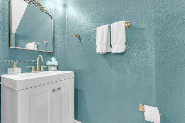 a bathroom with a sink and mirror