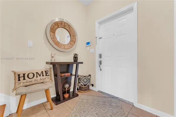 a view of an entryway with wooden floor