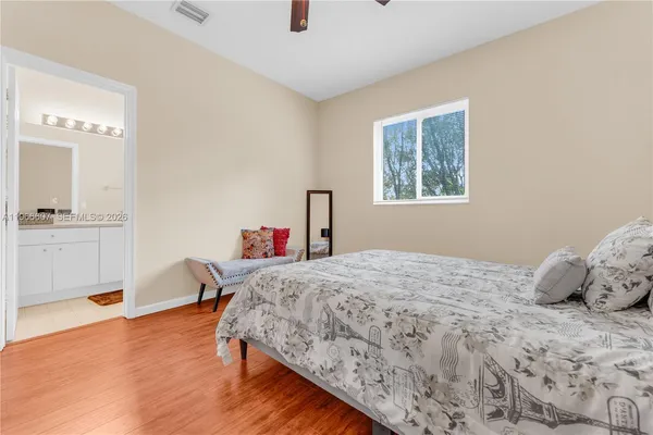 a bedroom with a bed and a table in it