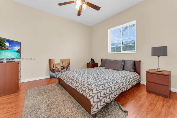 a bedroom with bed and window