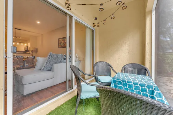 a living room with furniture and a rug