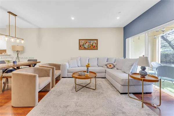 a living room with furniture and a large window