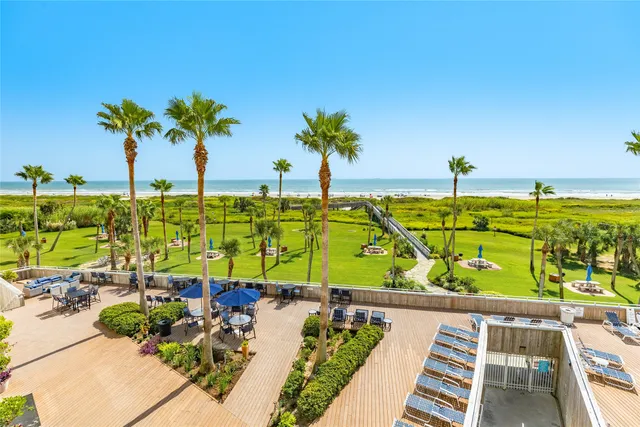 a bathroom with a sink mirror and tub