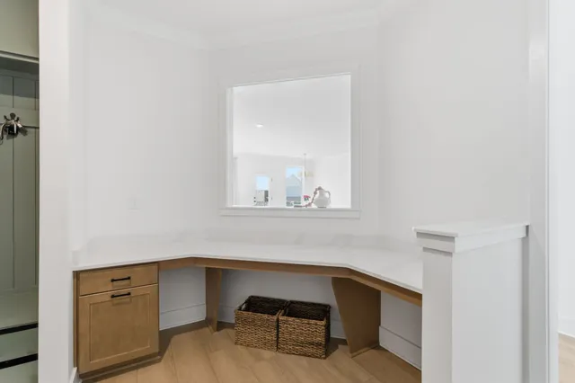 a bedroom with double bed and a large window