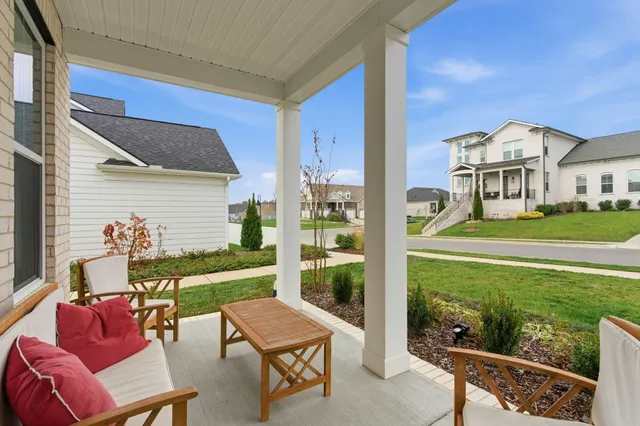 a front view of a house with a yard table and chairs