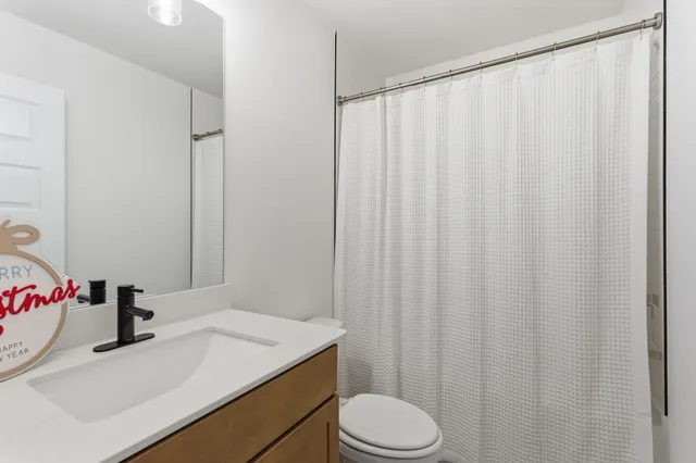 a livingroom with furniture and white walls