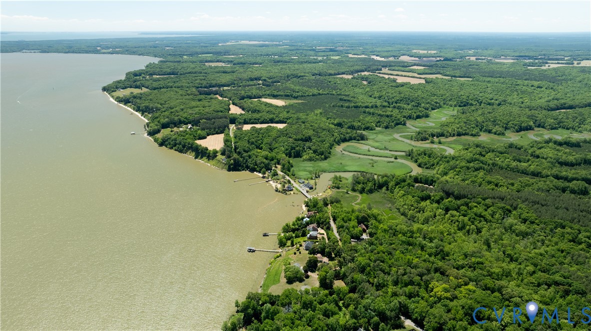 933 Pleasant Point Road Surry, VA 23883 - Photo 30 of 45 an aerial view of a house with a yard