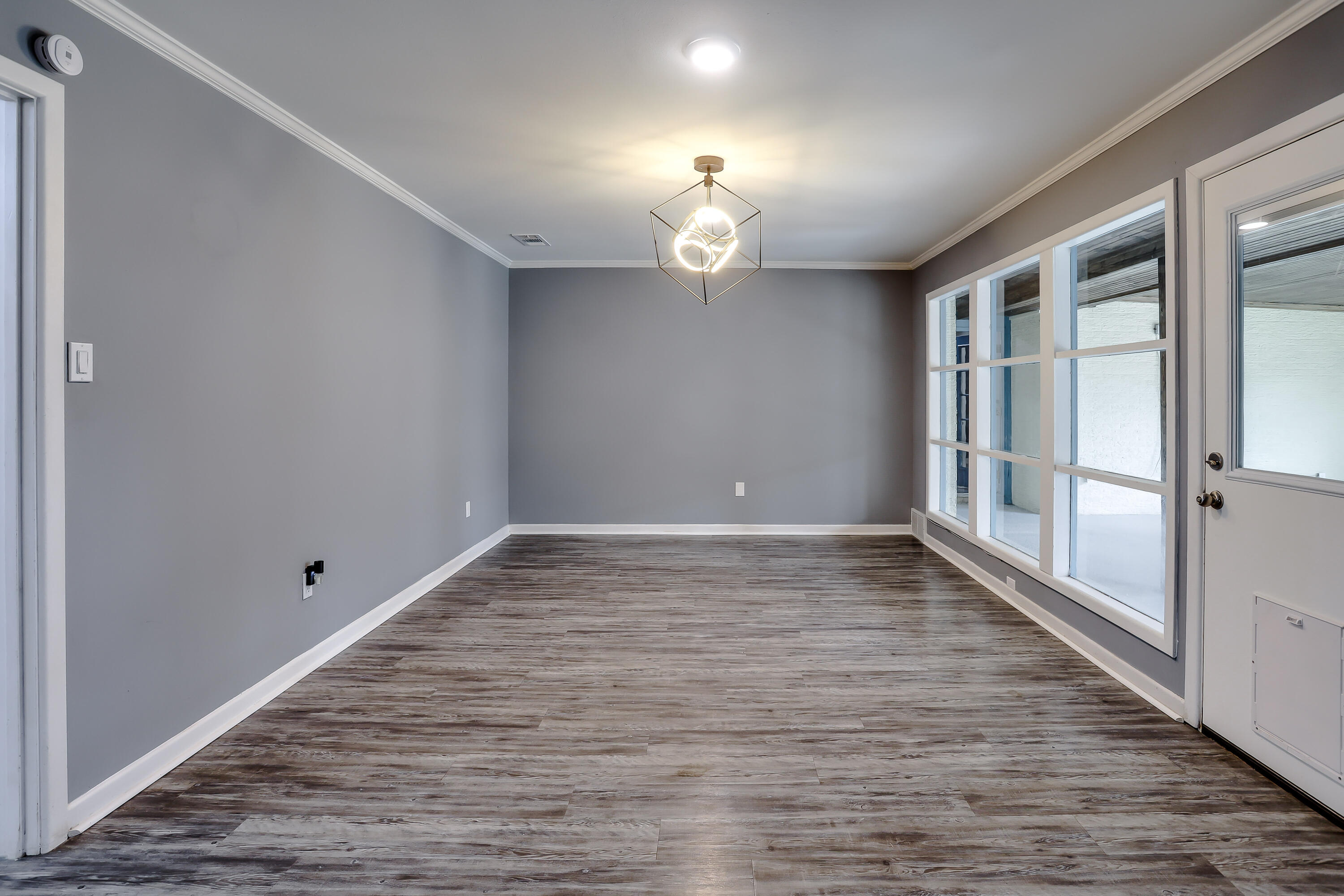 3615 47th Street Lubbock, TX 79413 - Photo 12 of 36 wooden floor in an empty room with a window