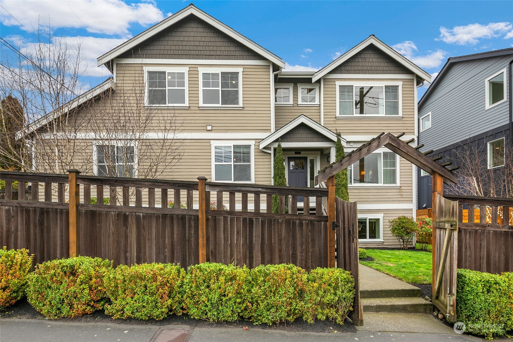 3616 Northeast 65th Street Seattle, WA 98115 - Photo 1 of 40 a front view of a house with a yard