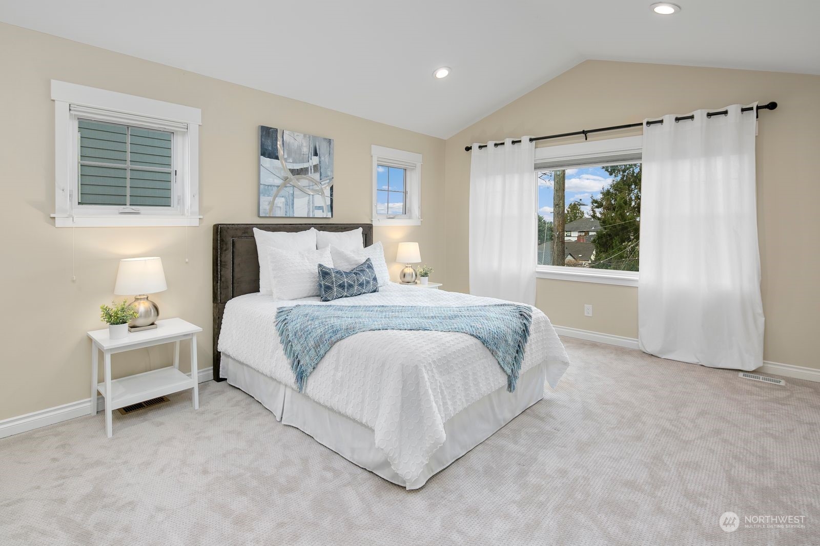 3616 Northeast 65th Street Seattle, WA 98115 - Photo 24 of 40 a spacious bedroom with a bed and a window