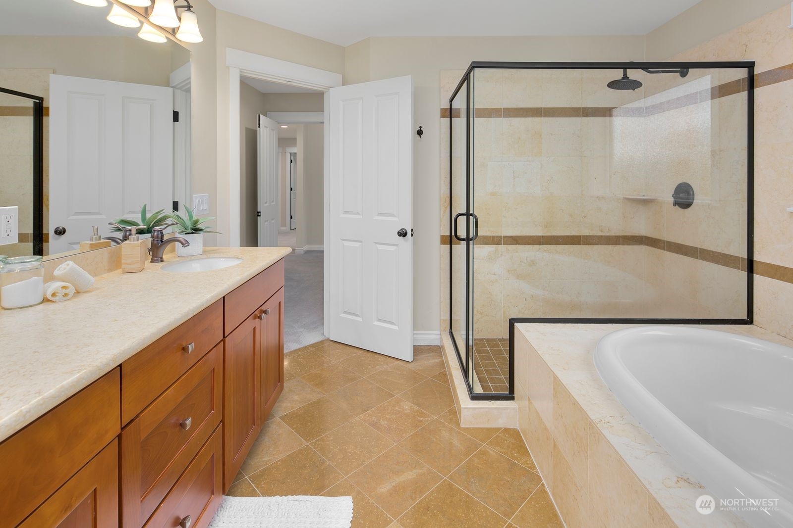 3616 Northeast 65th Street Seattle, WA 98115 - Photo 26 of 40 a spacious bathroom with a tub shower sink and mirror
