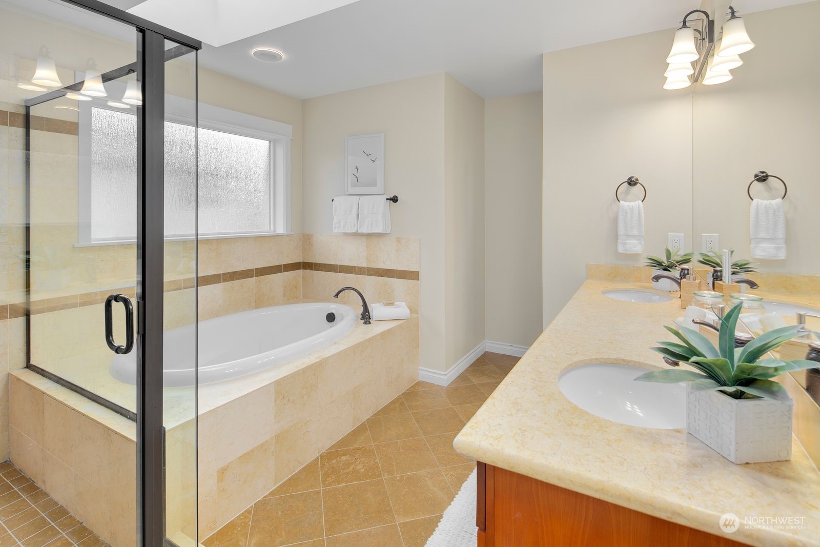 3616 Northeast 65th Street Seattle, WA 98115 - Photo 27 of 40 a bathroom with a bathtub sink and mirror