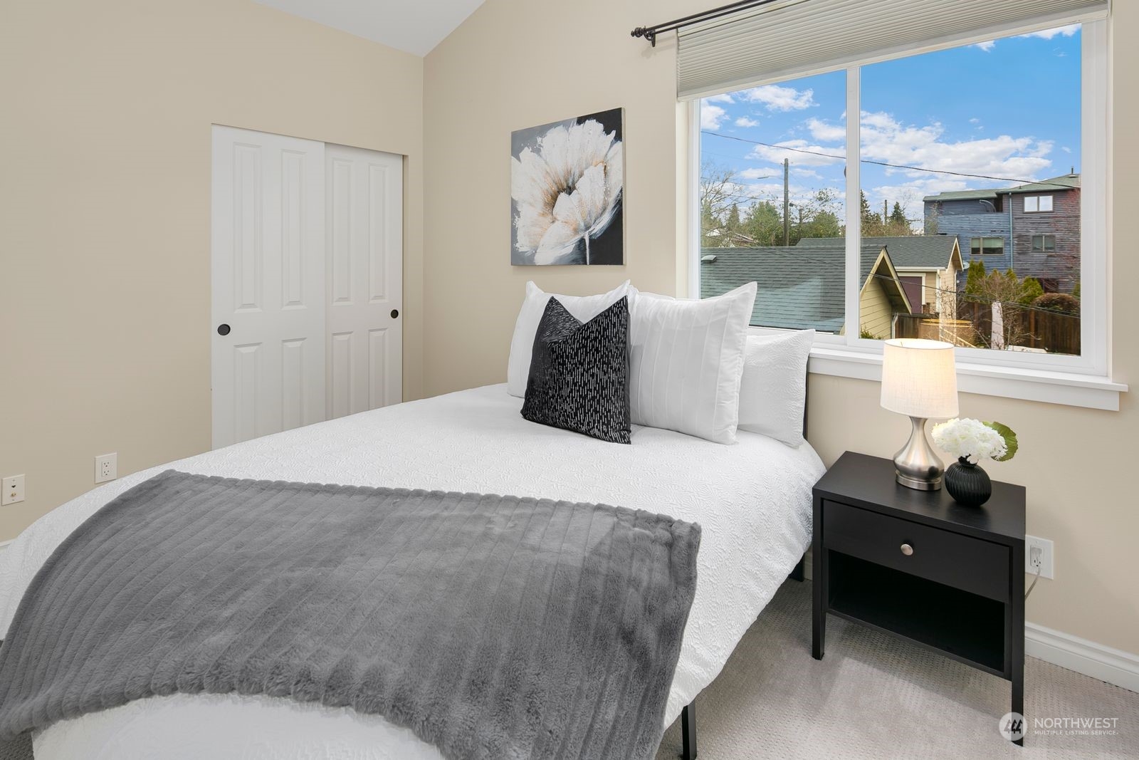 3616 Northeast 65th Street Seattle, WA 98115 - Photo 31 of 40 a bedroom with a large bed and a window