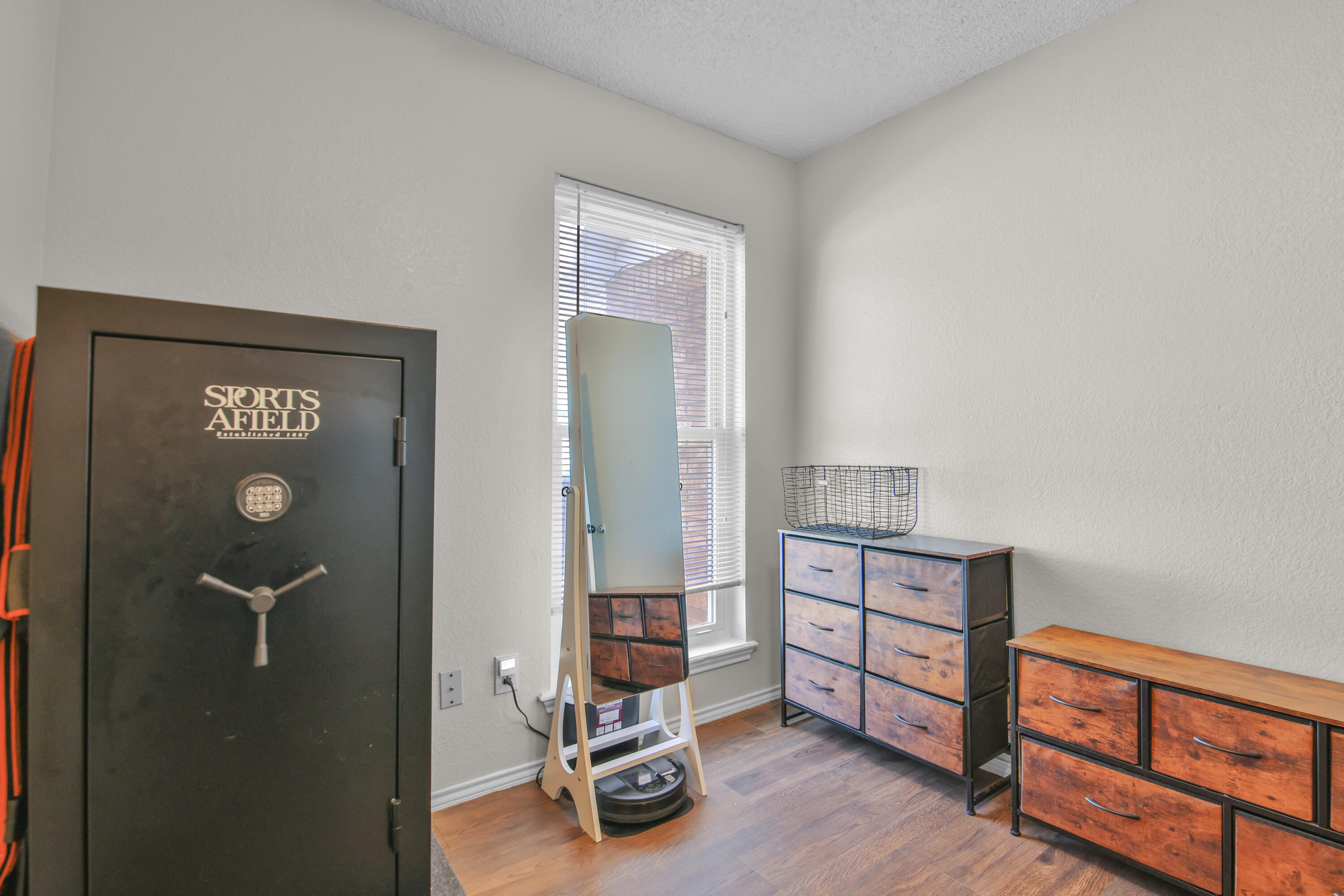 2216 86th Street Lubbock, TX 79423 - Photo 19 of 36 a view of a livingroom with furniture and hardwood floor