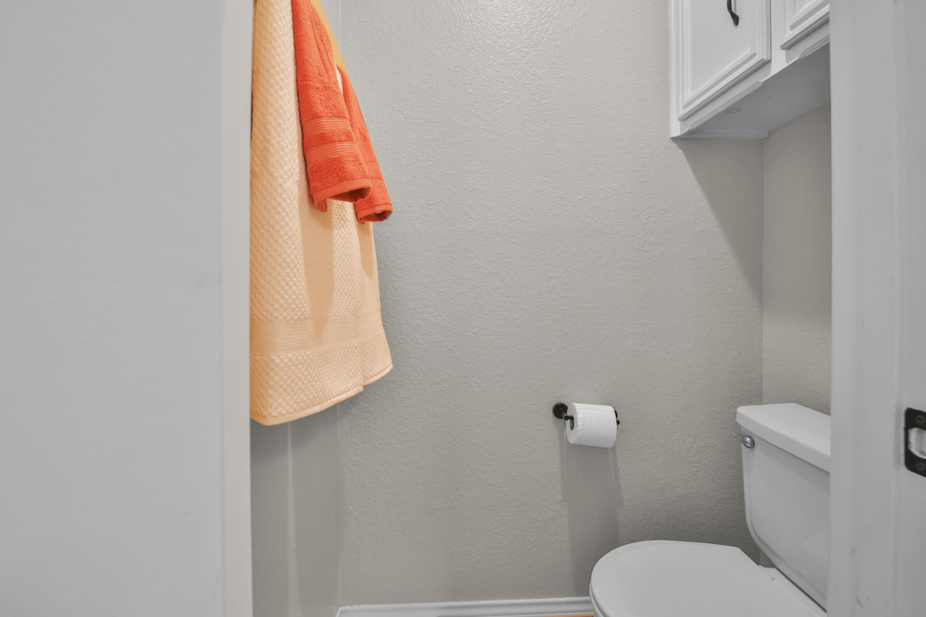 2216 86th Street Lubbock, TX 79423 - Photo 25 of 36 a bathroom with a toilet and a shower curtain
