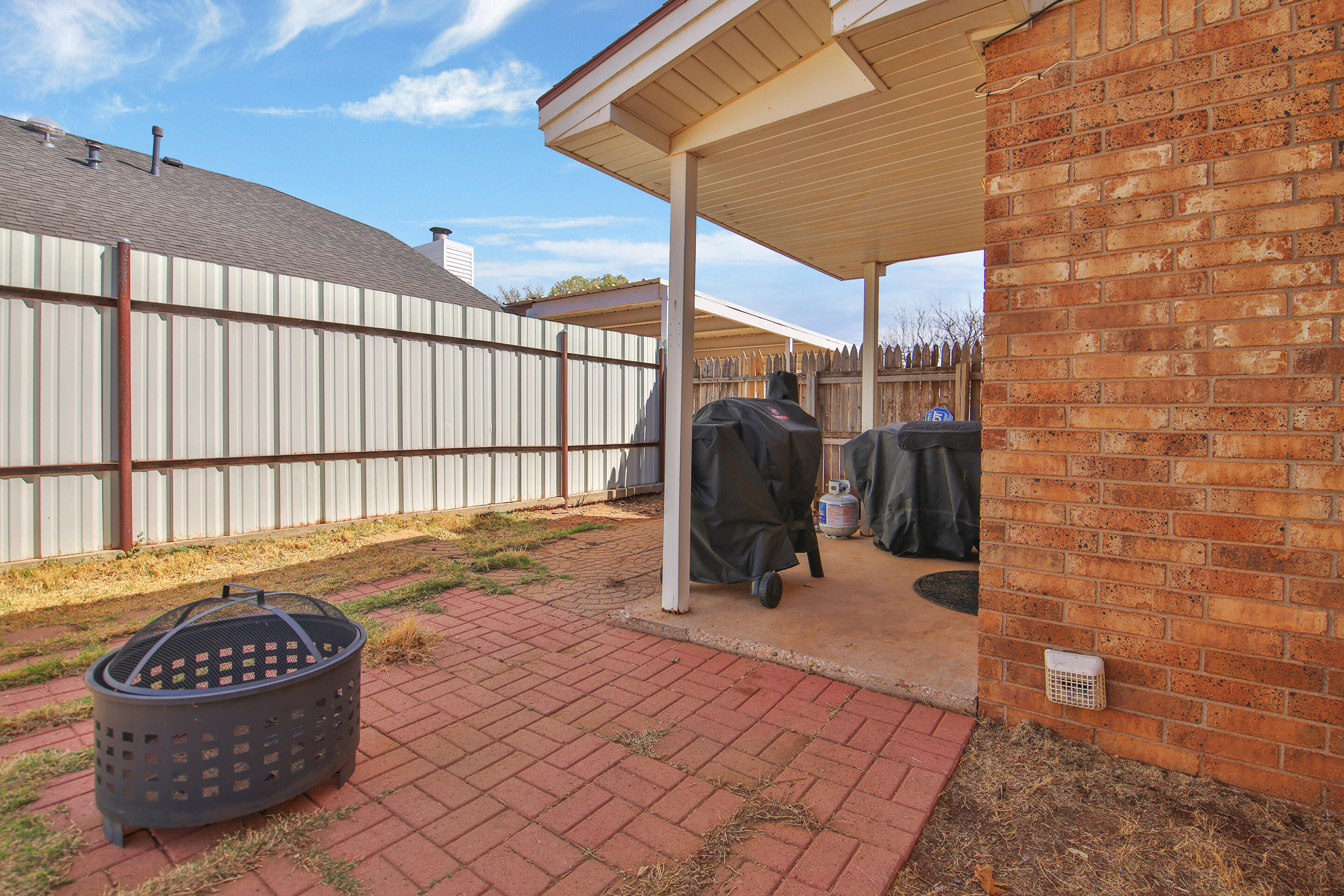 2216 86th Street Lubbock, TX 79423 - Photo 33 of 36 a view of a chairs and tables in the patio