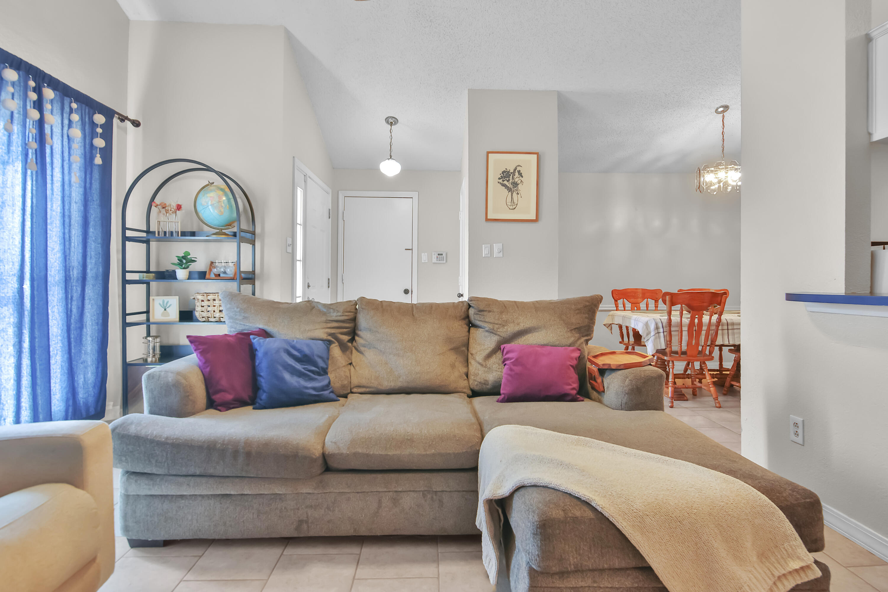 2216 86th Street Lubbock, TX 79423 - Photo 8 of 36 a living room with furniture or couch and a potted plant