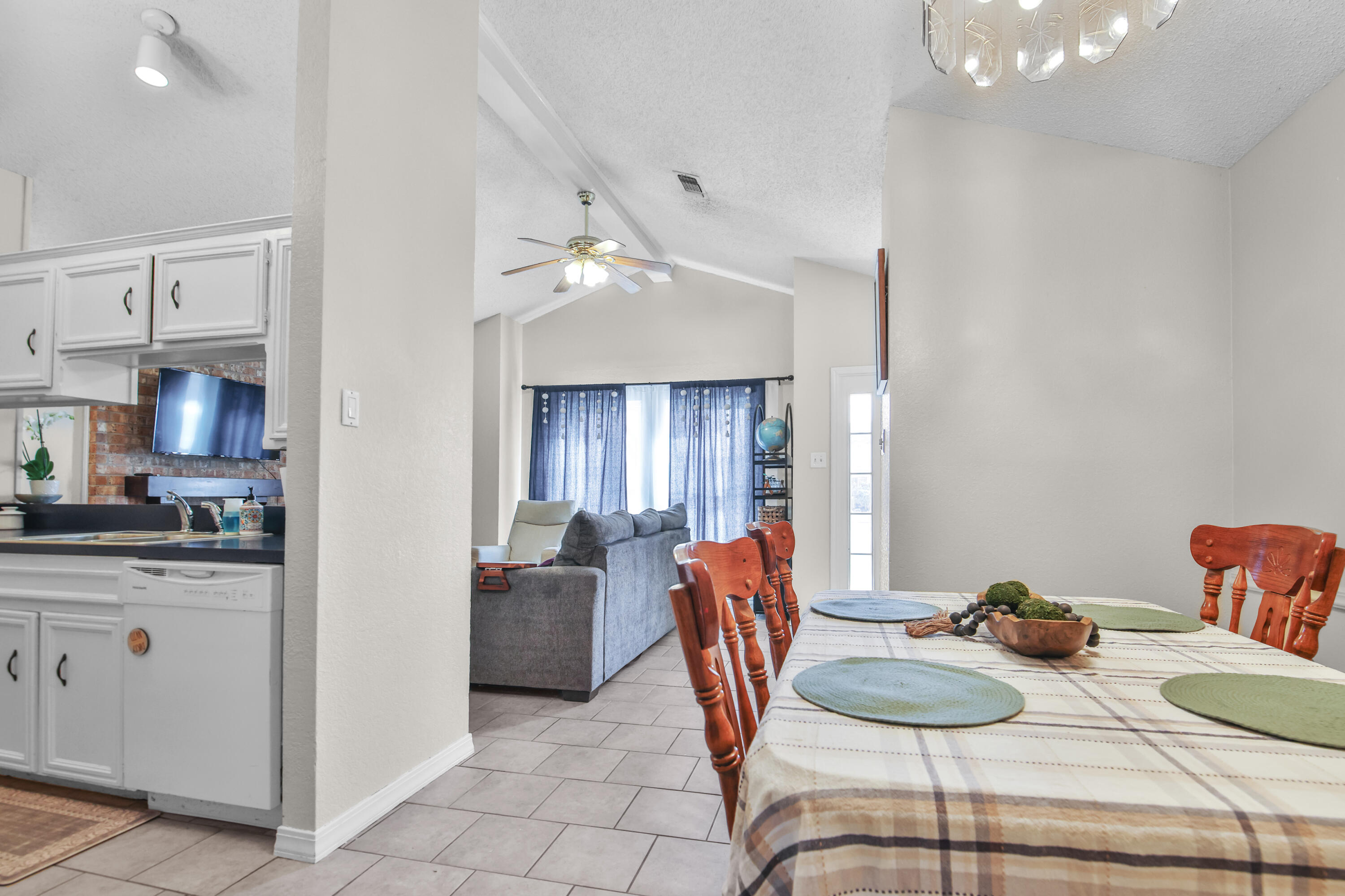 2216 86th Street Lubbock, TX 79423 - Photo 9 of 36 a view of a dining room with furniture and chandelier