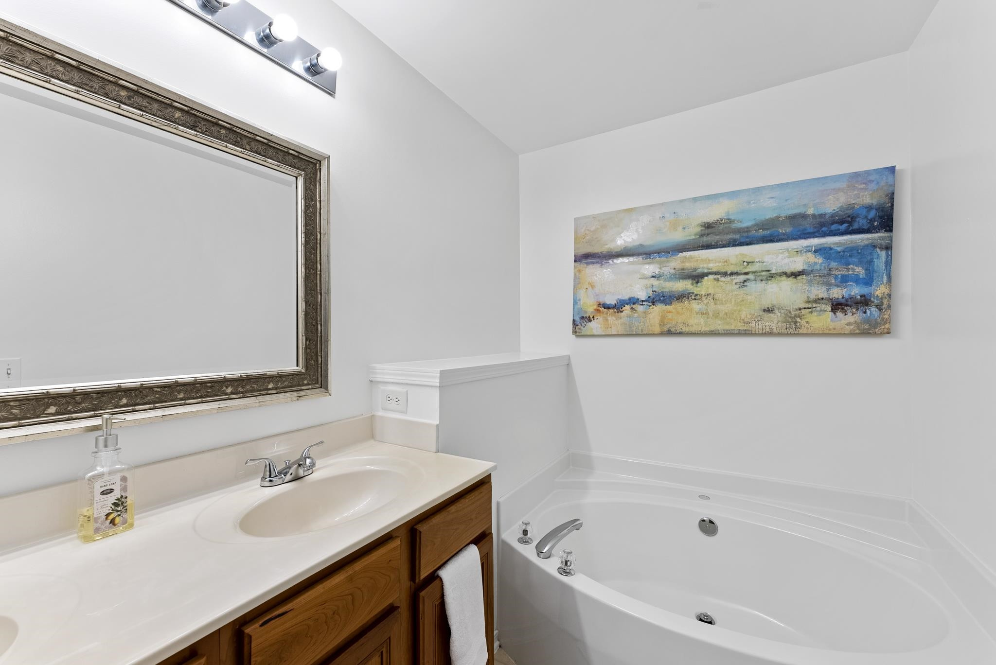 8510 Pillar Gate Lane Raleigh, NC 27613 - Photo 27 of 33 a bathroom with a bathtub and a sink