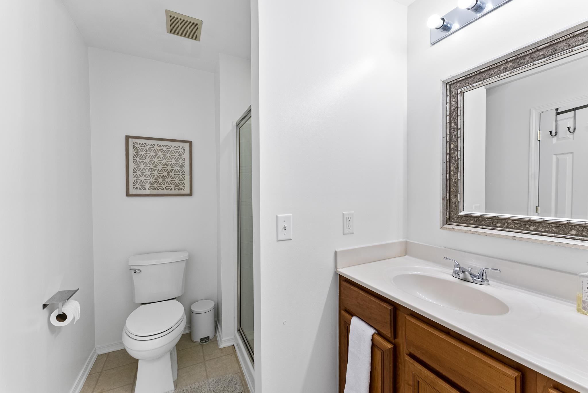 8510 Pillar Gate Lane Raleigh, NC 27613 - Photo 28 of 33 a bathroom with a toilet sink and mirror