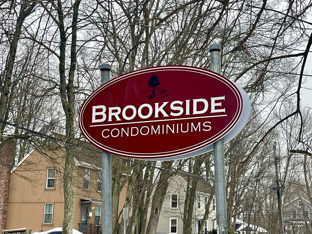 126 Beaver Street, Unit 56 Framingham, MA 01702 - Photo 2 of 8 a sign broad on a pole