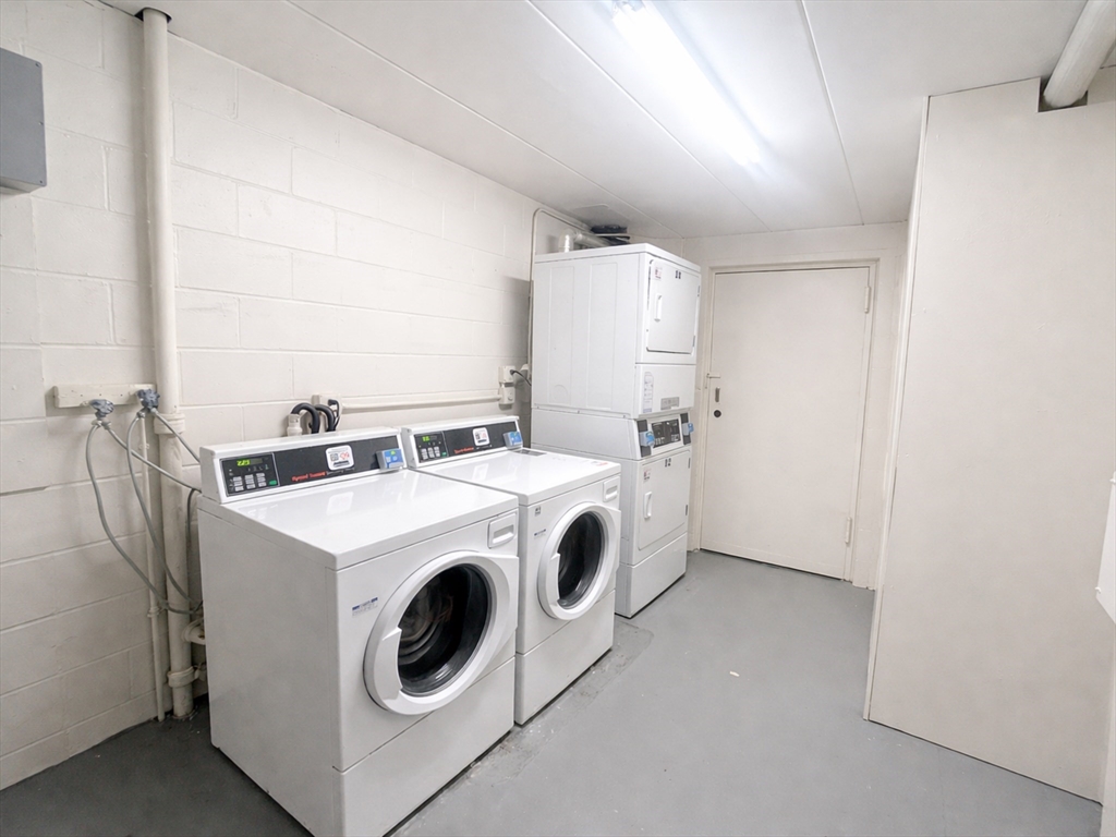126 Beaver Street, Unit 56 Framingham, MA 01702 - Photo 7 of 8 a utility room with dryer and washer