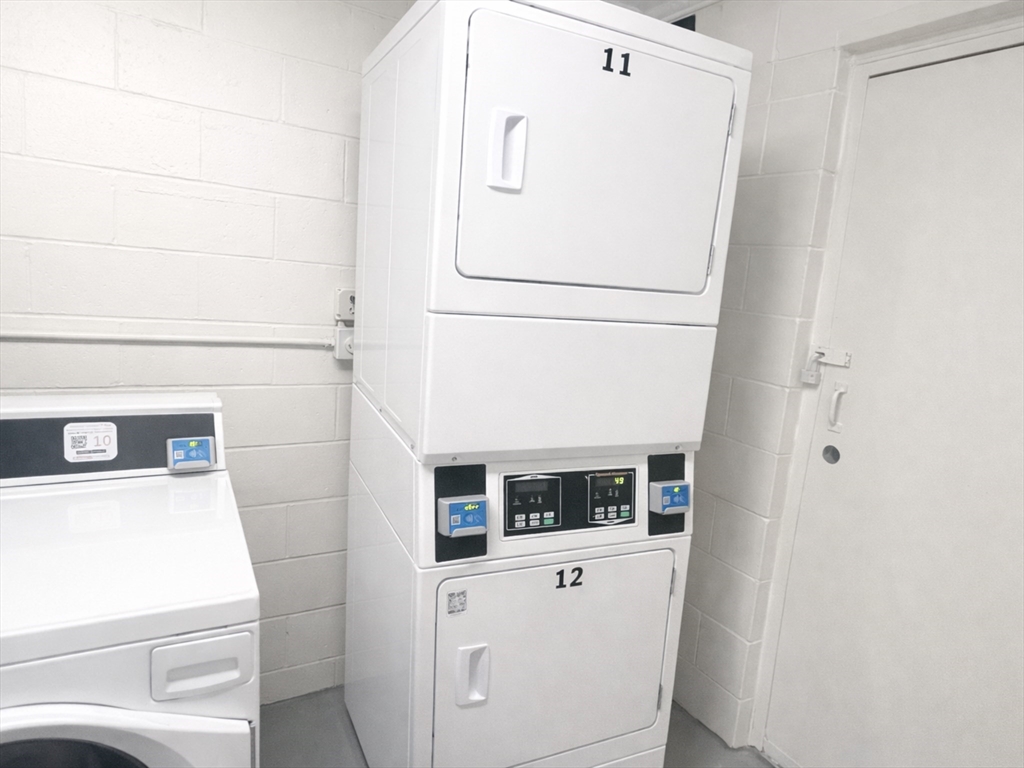 126 Beaver Street, Unit 56 Framingham, MA 01702 - Photo 8 of 8 a utility room with dryer and washer