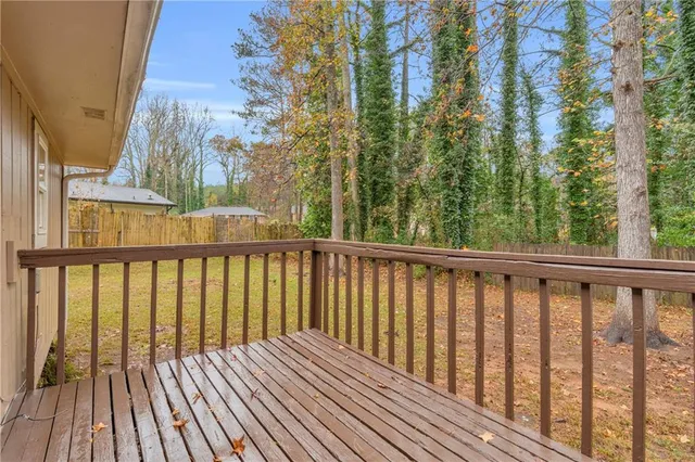 a view of balcony with wooden floor