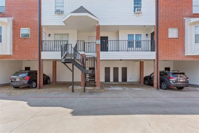 a view of a car park in front of a building