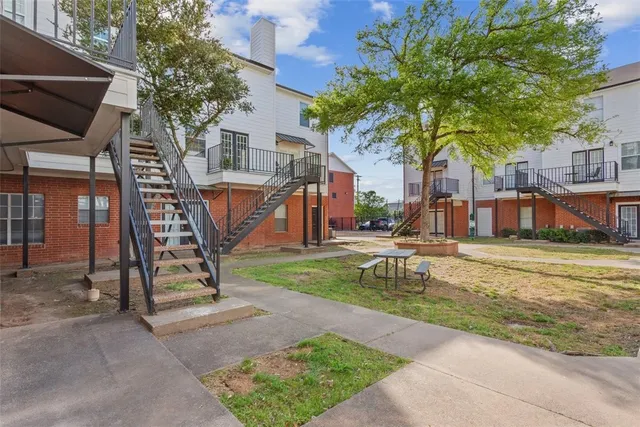 a view of a park with swings and slides