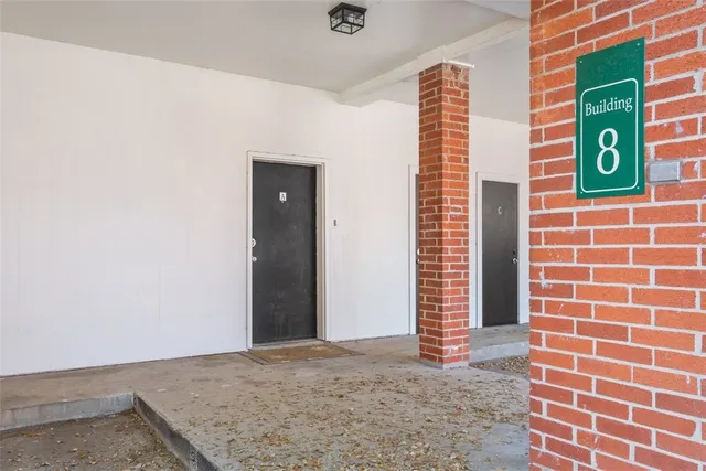 a view of a brick house with a window