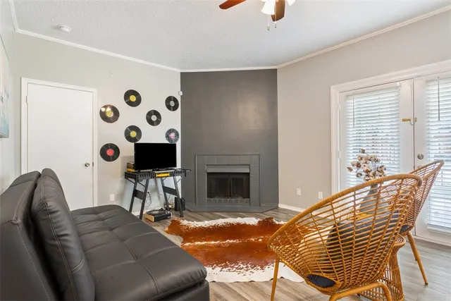 a living room with furniture and a fireplace