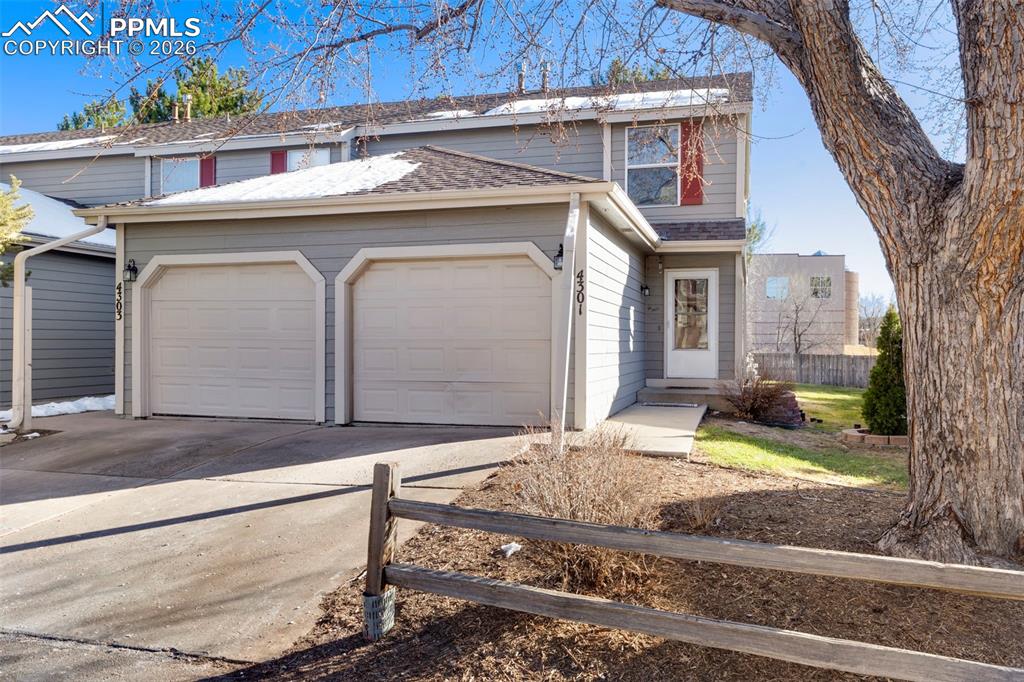 End unit 2-story Condominium with attached one car garage