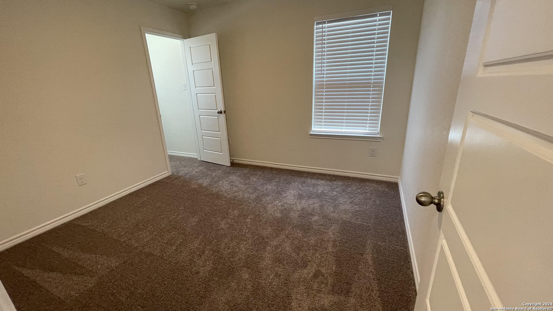 14839 Vance Jackson Road, Unit 606 San Antonio, TX 78249 - Photo 13 of 13 a view of an empty room with a window