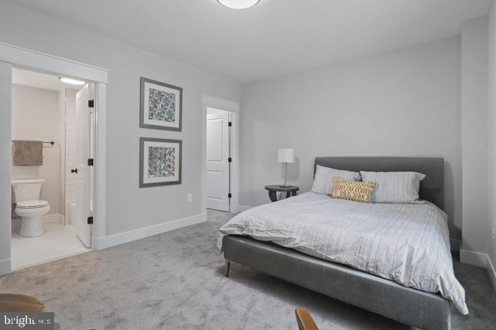 2806 Norbeck Road Silver Spring, MD 20906 - Photo 19 of 36 a bedroom with a bed and a view of bathroom