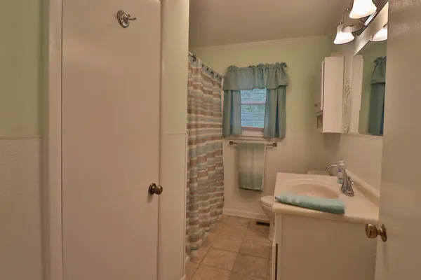 a bathroom with a sink and mirror