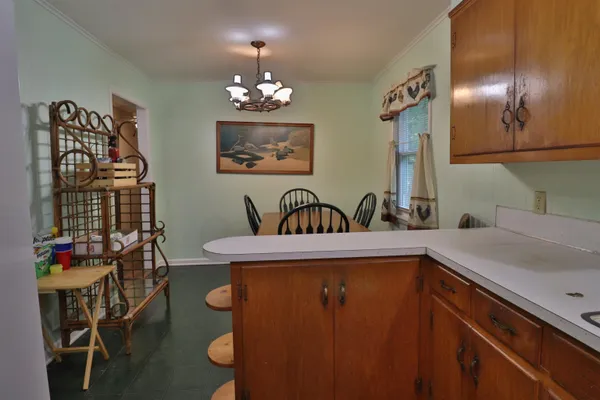 a view of a kitchen with a sink and cabinets