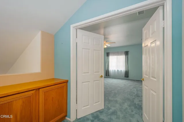 a view of a hallway with closet