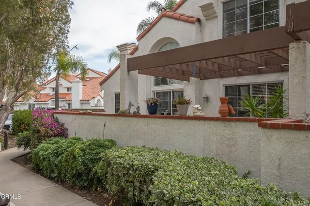 front view of a house with a small yard