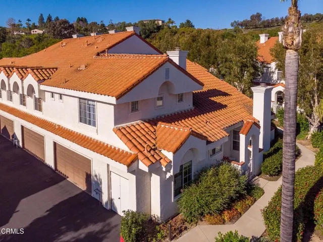 a aerial view of a house with a yard