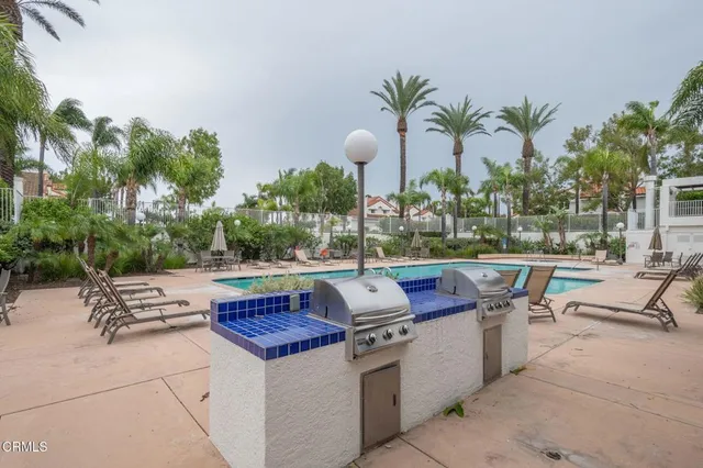 a view of outdoor sitting area with furniture and wooden floor