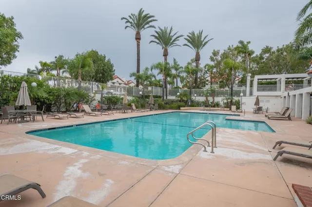 a view of a swimming pool with a patio
