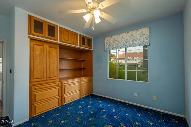 a room with closet and windows