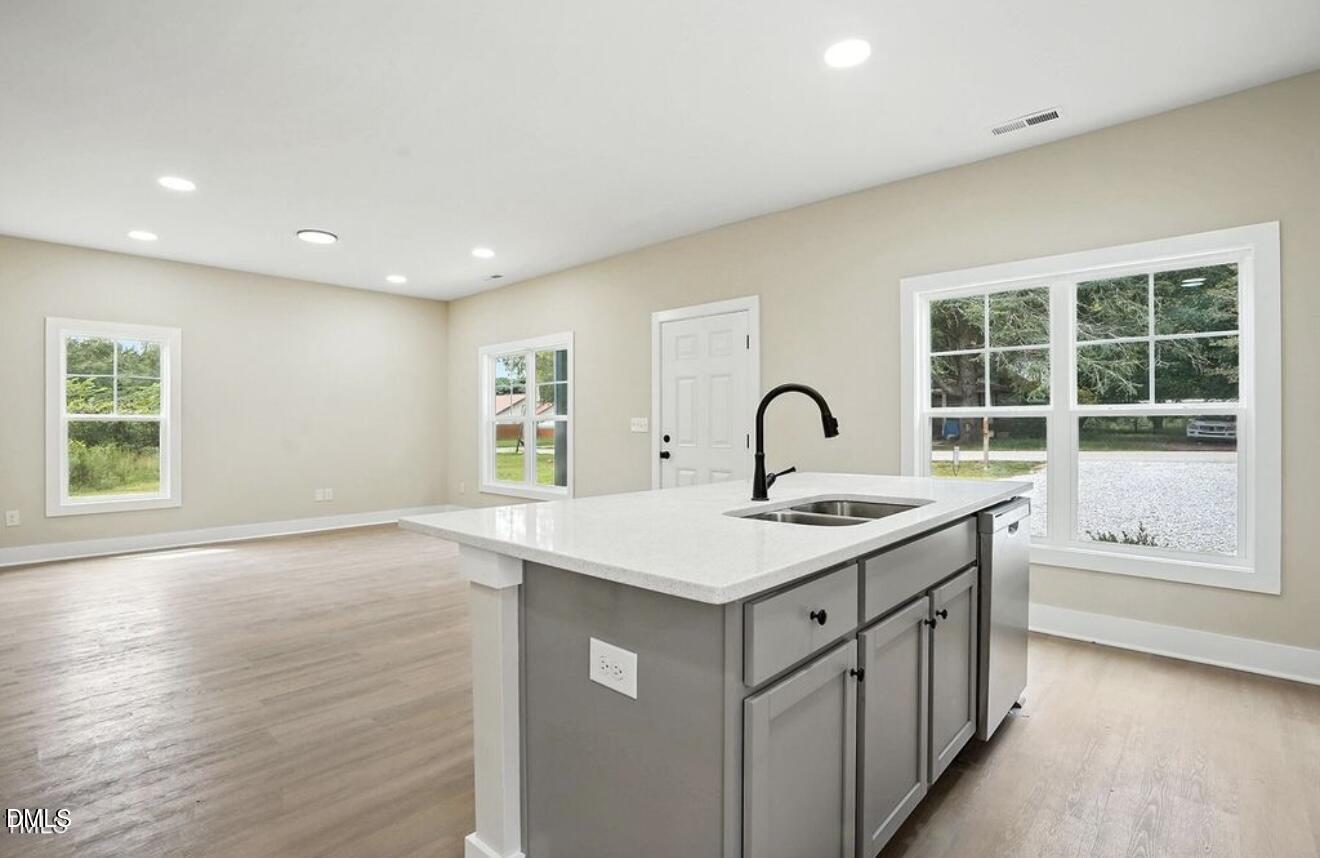 1240 West Blackman Road Dunn, NC 28334 - Photo 11 of 25 a kitchen with a sink and large window