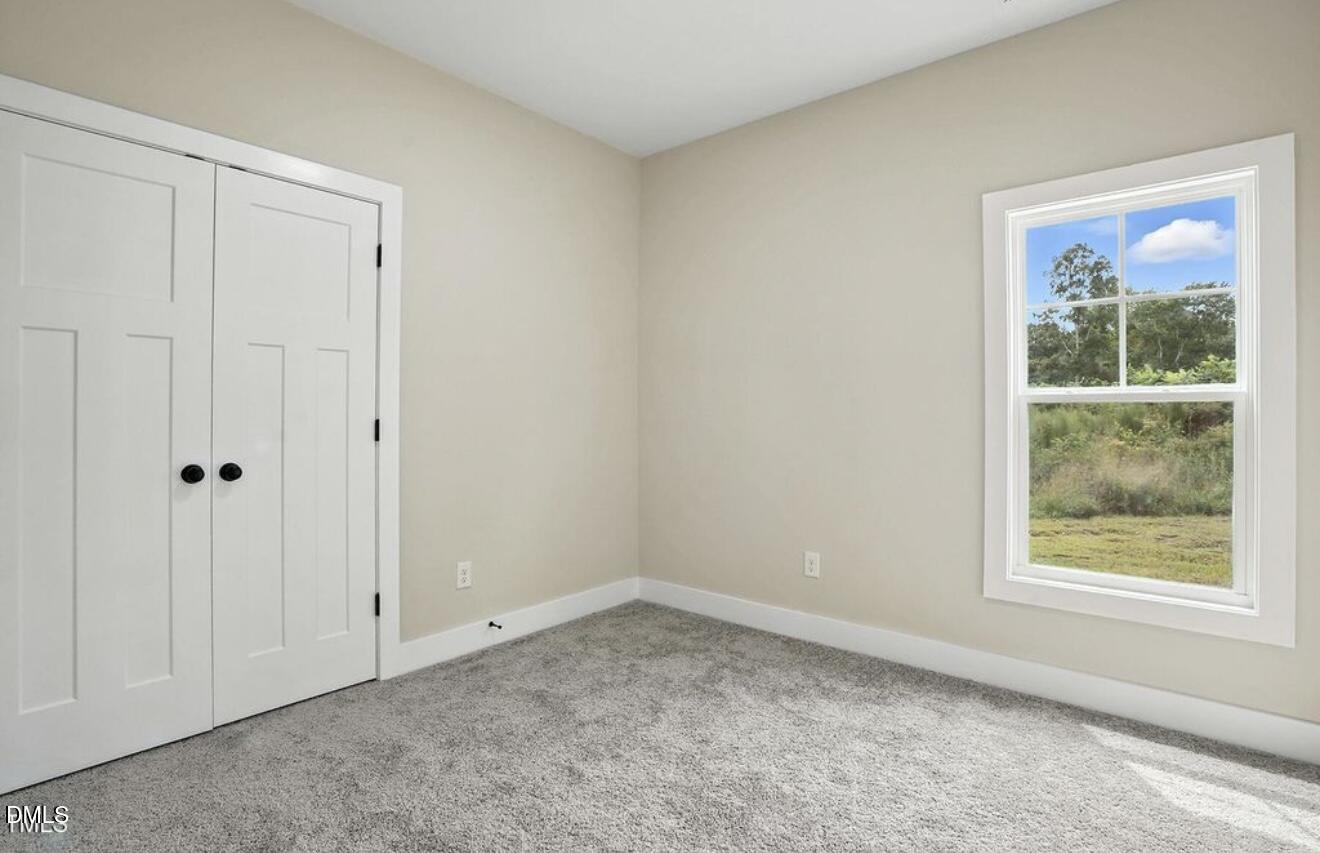 1240 West Blackman Road Dunn, NC 28334 - Photo 14 of 25 a view of an empty room with a window